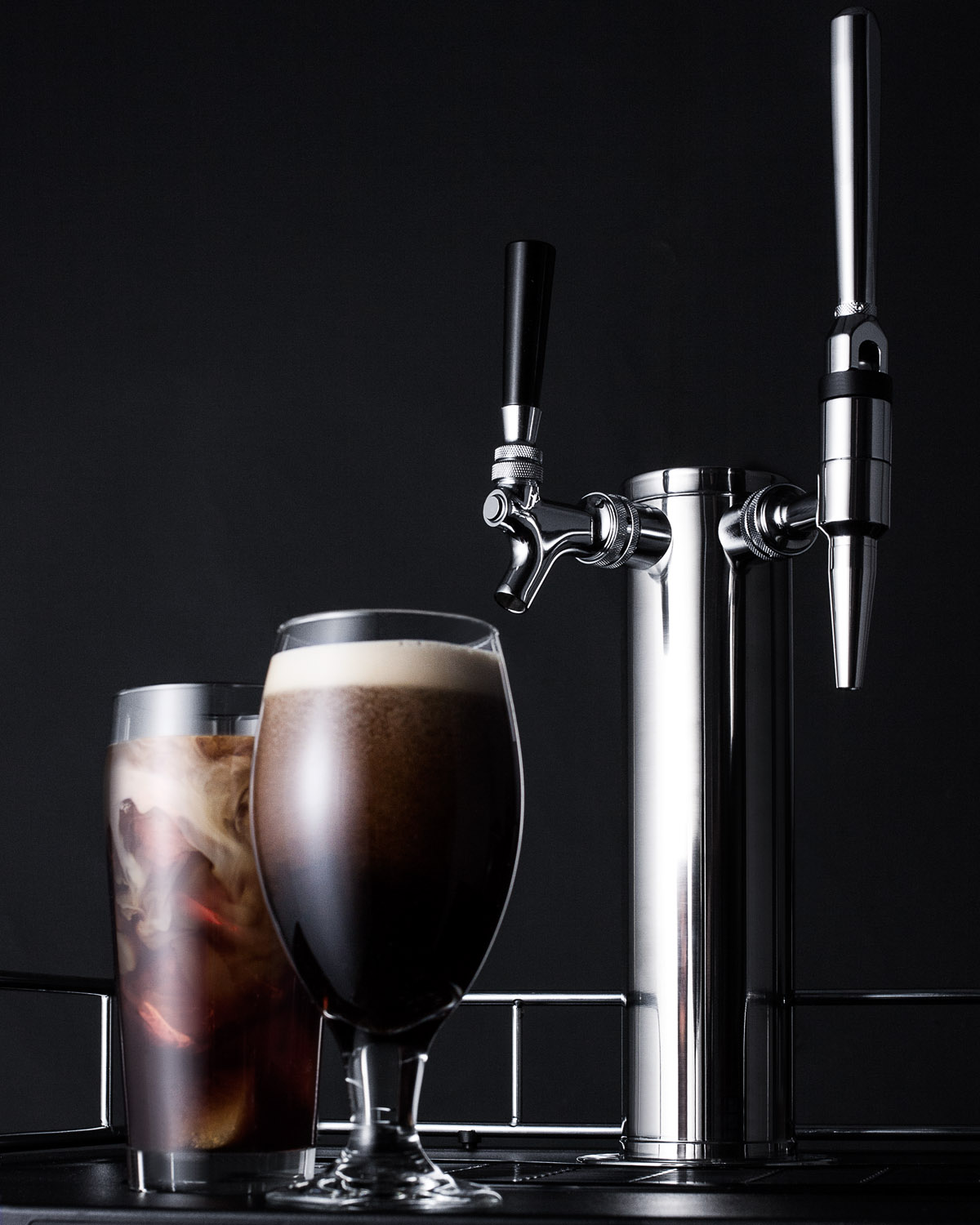 Dual tap coffee dispenser in black, with a combination nitro/flat coffee tap kit in stainless steel
